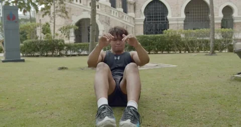 A man doing abdominal crunches workout - wide angle shoot Video stock 146096840