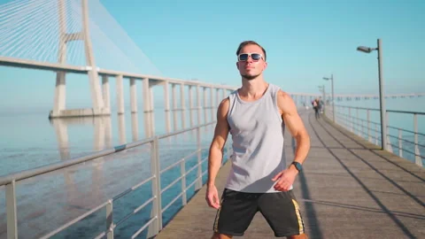 Man doing arm and shoulder warm-up exercises Stock Footage 255301632