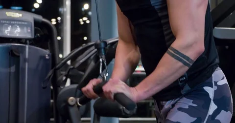 Man doing arms weight exercise 4k gym video. Training triceps on cable machine Stock Footage 71800919