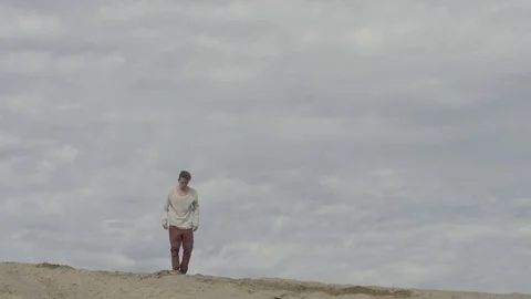 Man doing back flip on beach Stock Footage