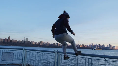 Man doing back flip at promenade Stock Footage 99753758