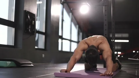 Man doing Back Stretching Exercises  Workout in Gym. Stock Footage 201406405