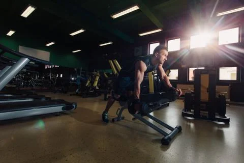 Man doing back training in the gym Stock Photos