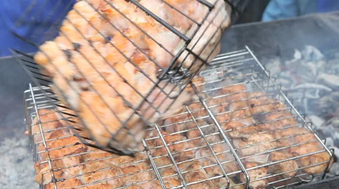 Man Doing a Barbecue on Sities Market Stock Footage 62201625