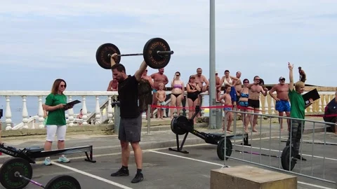 Man doing barbell squats during crossfit and endurance competition Stock Footage 205065436