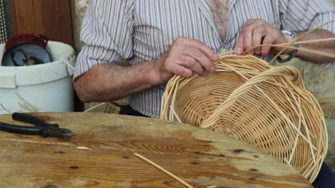 Man doing basket weaving in a traditional way Stock Footage 245223254
