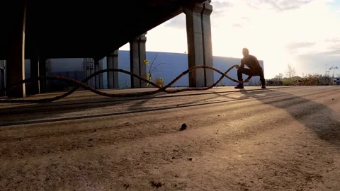 Man doing battle ropes training Stock Footage 134692778