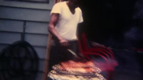 Man Doing BBQ 16mm Super8 Video stock 11146199