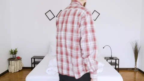 Man doing the bed in a authentic room. Stock Footage