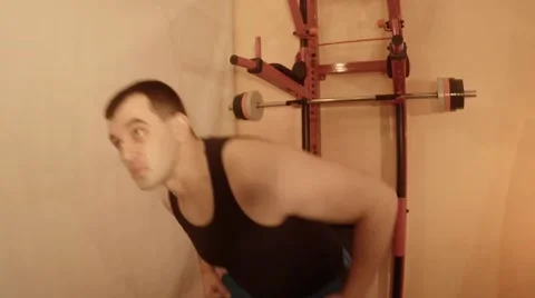 Man Doing Bench Press From Breast Using Bar on Wall Bars Stock Footage 62473172