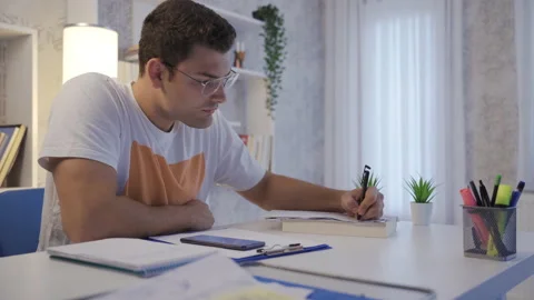 Man doing calculations on papers. Stock Footage 220169909