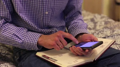 Man Doing Calculations on Phone 스톡 동영상 60005025