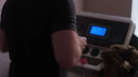 Man doing cardio exercises on a treadmill to improve heart and lung function. Stock Footage 305570500