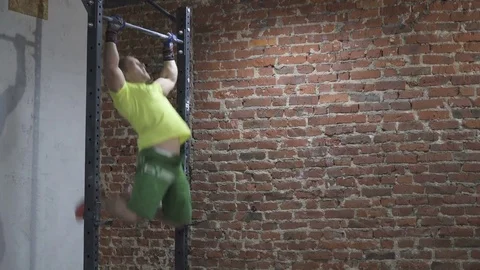 Man doing chest to bar pull-up in gym Stock-Footage 72739421
