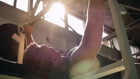Man doing chest press in gym Stock Footage 77877057