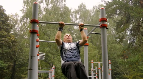 A man is doing chin-ups Stock Footage 66542270