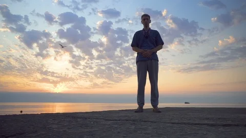 Man Doing Chinese Exercises at Sunset Stock Footage 115125288
