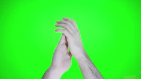 Man doing claps her hands on a green screen background. Stock Footage