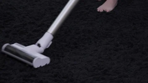 Man doing cleaning in the apartment with a vacuum cleaner 스톡 동영상 199641095