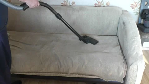 A man doing cleaning with a vacuum cleaner Video stock 167439644