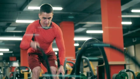 A man is doing crossfit work-out in the gym Stock Footage 130881104