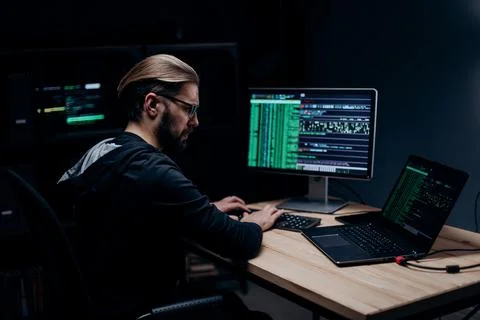 Man doing cyber attacks on computer 스톡 사진