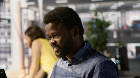 Man doing data entry, typing on keyboard on computer in office Stock Photos