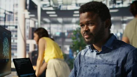 Man doing data entry, typing on keyboard on computer in office Stock Photos