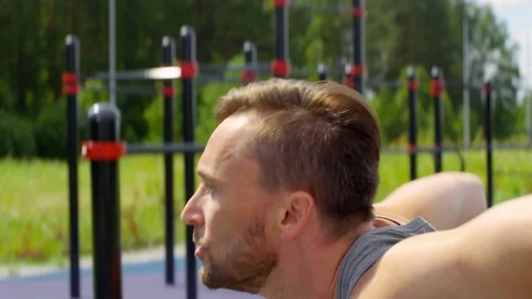 Man Doing Dips on Parallel Bars Outdoor 動画素材 97638177