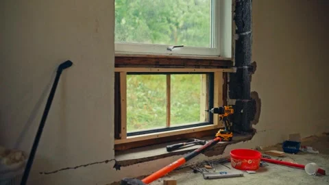 Man Doing A DIY Window Replacement Project - Timelapse Stockbeeldmateriaal 336706573