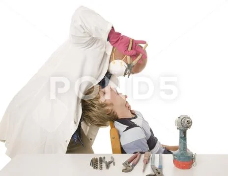 A man doing do it yourself dentistry with industrial tools. Stock Photos
