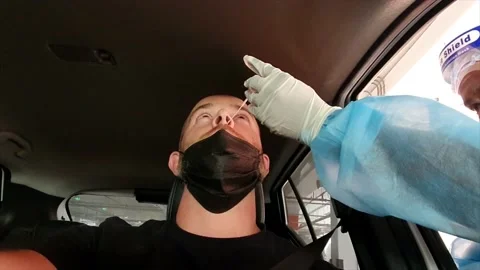 Man doing drive through PCR test Stock Footage 154617642