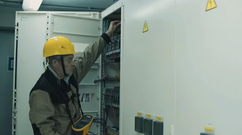 Man doing electrical metering equipment Video stock 68509350