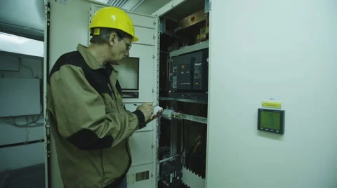 Man doing electrical metering equipment Video stock 68512131