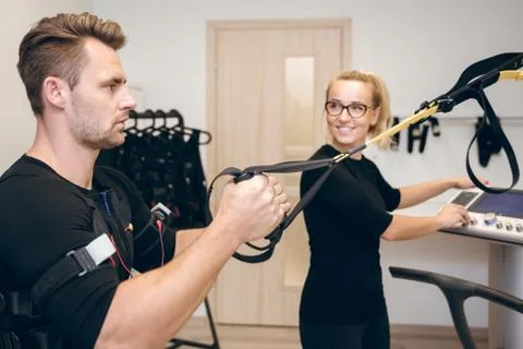 Man doing ems training and his coach Stock Photos
