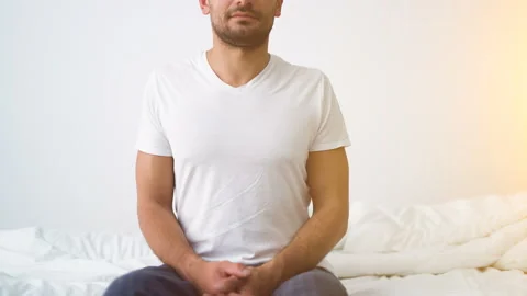 The man doing exercise on the bed Stock Footage 90044006