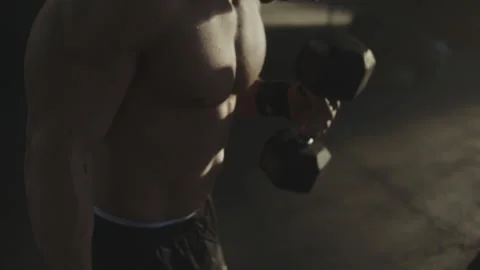 Man doing exercise with dumbbell Stock Footage 236179559