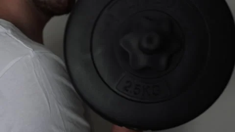 Man Doing Exercise With Dumbbells A Body Workout at home Stock Footage 130870506