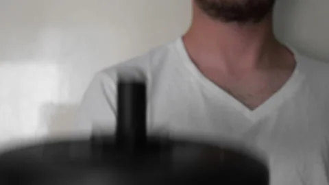 Man Doing Exercise With Dumbbells A Body Workout at home Stock Footage 130870528