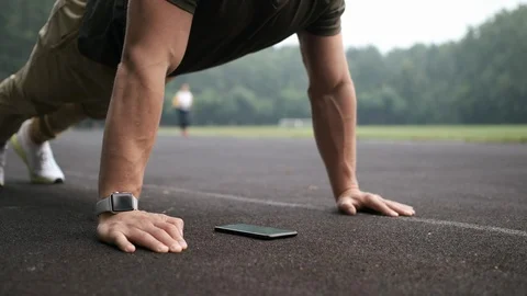 Man doing exercise following the instruction on digital smart phone. Stock Footage 113062841