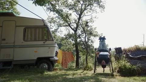 Man doing exercise on inversion table in camp to relax, improve overall posture 스톡 동영상 127544038