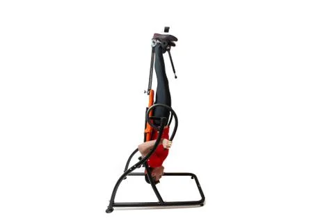 Man doing exercise on inversion table for his back pain, isolated on white Stock Photos