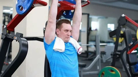 Man doing exercise on the machine Stock Footage 102249263