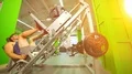 The man doing exercise in a modern sport center on the bright light background 4k or 4k+ Resolution