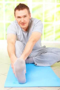 Man doing exercise Stock Photos