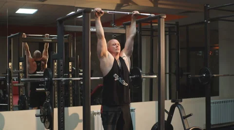 Man doing exercise at the press on the simulator Stock Footage 62233325