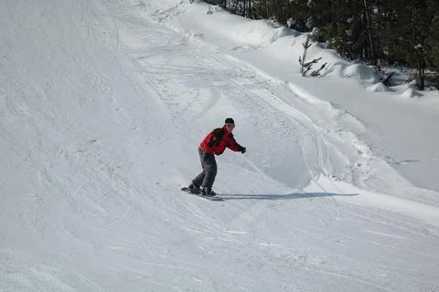 Man doing exercise on snowboard Stock Photos