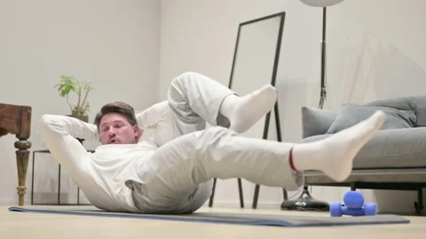 Man doing Exercise on Yoga Mat at Home Video stock 157325077