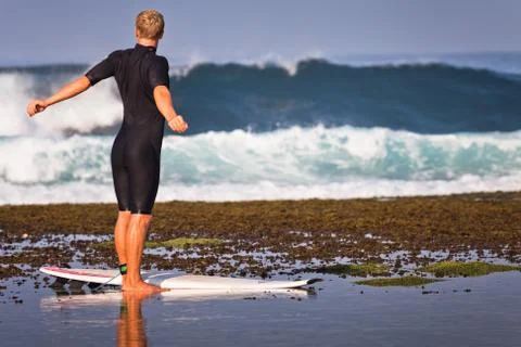 Man doing exercises at the beach Stock Photos