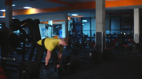 Man doing exercises on the buttocks with the rod Stock Footage 62230897